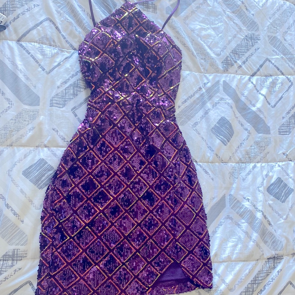 Dark purple halter mini dress with adjustable straps and zipper back